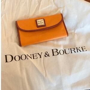 Dooney & Bourke Pebble Grain Continental Clutch Wallet in orange/clementine.
